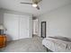 Neutral bedroom with carpeted floor, closet, ceiling fan, and ample space at 5454 S Everett Ct, Littleton, CO 80123