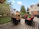 This outdoor deck has an inviting stone fireplace with comfortable seating around it at 5454 S Everett Ct, Littleton, CO 80123