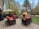 Relax on this beautiful deck with outdoor seating and a cozy stone fireplace at 5454 S Everett Ct, Littleton, CO 80123