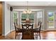 Dining area with hardwood floors, chandelier and backyard views at 5454 S Everett Ct, Littleton, CO 80123