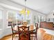 Dining area with large windows offering backyard views and hardwood floors at 5454 S Everett Ct, Littleton, CO 80123