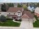 Beautiful two-story home with a well-manicured lawn, mature trees, and an attached two-car garage at 5454 S Everett Ct, Littleton, CO 80123