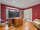 Home office with a bay window, wood floors, and glass paneled french doors at 5454 S Everett Ct, Littleton, CO 80123