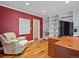 Home office with wood floors, built-in bookshelves, and a large desk for a productive workspace at 5454 S Everett Ct, Littleton, CO 80123