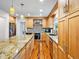 Updated kitchen with granite countertops, stainless steel appliances, and custom cabinetry at 5454 S Everett Ct, Littleton, CO 80123