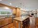 Bright kitchen with a large island featuring granite countertops, ample storage, and seamless transition to living areas at 5454 S Everett Ct, Littleton, CO 80123