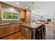 Kitchen with stainless steel appliances, wood cabinets and a large island with seating at 5454 S Everett Ct, Littleton, CO 80123