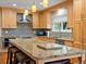 Beautiful kitchen featuring granite countertops, a tile backsplash, and ample cabinet space at 5454 S Everett Ct, Littleton, CO 80123