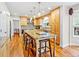 Spacious kitchen with granite countertops, island seating, and modern appliances at 5454 S Everett Ct, Littleton, CO 80123
