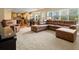 Open concept living room with a large sofa and adjacent dining area at 5454 S Everett Ct, Littleton, CO 80123