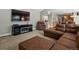 Comfortable living room with modern media center, plush seating and hardwood floors at 5454 S Everett Ct, Littleton, CO 80123