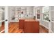 Bright office features custom built-ins, hardwood floors, and a large desk area at 5454 S Everett Ct, Littleton, CO 80123