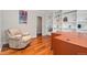 Office with a comfortable recliner, a large desk with lots of workspace and bright white built in book shelves at 5454 S Everett Ct, Littleton, CO 80123