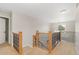 Elegant staircase featuring carpeted steps, decorative railing and natural light at 5454 S Everett Ct, Littleton, CO 80123