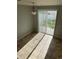 Bright dining area with sliding glass doors leading to the patio at 5537 Malta St, Denver, CO 80249