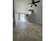 Open living space with tile floors, stairway, and access to the backyard at 5537 Malta St, Denver, CO 80249