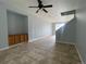 Open living area with tile flooring and a built-in cabinet at 5537 Malta St, Denver, CO 80249