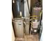 Utility room featuring a Carrier furnace and Rheem hot water heater and tile flooring at 5537 Malta St, Denver, CO 80249