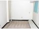 Unfinished basement area with neutral carpet, white walls, and black trim at 6150 W Mansfield Ave # 33, Denver, CO 80235