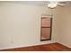 Bedroom with hardwood floors and window offering natural light at 6150 W Mansfield Ave # 33, Denver, CO 80235