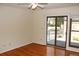 Bright living room with hardwood floors and sliding glass door leading to the outside at 6150 W Mansfield Ave # 33, Denver, CO 80235