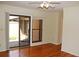 Inviting living room featuring hardwood floors and a large window with courtyard view at 6150 W Mansfield Ave # 33, Denver, CO 80235