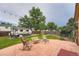 Stamped patio with outdoor seating, grassy lawn and RV parking at 4162 S Dunkirk Way, Aurora, CO 80013