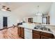 Spacious kitchen with stainless steel sink that overlooks the living room; ideal for entertaining and casual living at 4162 S Dunkirk Way, Aurora, CO 80013