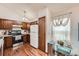 Well-lit kitchen offers wood cabinetry, stainless steel appliances, and a charming breakfast nook with lots of sunlight at 4162 S Dunkirk Way, Aurora, CO 80013