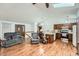 Open-concept living room flows into the kitchen featuring hardwood floors and a vaulted ceiling with a skylight at 4162 S Dunkirk Way, Aurora, CO 80013