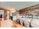 Bedroom featuring an accent wall, plush carpet, a window seat, and en-suite access with an updated bathroom at 4162 S Dunkirk Way, Aurora, CO 80013