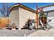 Backyard shed with grill and woodpile at 835 Lewis Dr, Lakewood, CO 80215