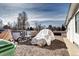 Motorcycle and covered vehicle in backyard at 835 Lewis Dr, Lakewood, CO 80215
