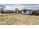 Cozy single-story home featuring manicured lawn and appealing exterior in a quiet neighborhood at 835 Lewis Dr, Lakewood, CO 80215