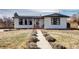 Charming single-story home with a well-maintained front yard and inviting entrance pathway at 835 Lewis Dr, Lakewood, CO 80215