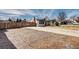 Attractive house features a large parking area, well-maintained lawn, and appealing exterior design at 835 Lewis Dr, Lakewood, CO 80215