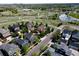 An aerial view of the property, showcasing its location near a park, green spaces, and a pond at 3386 Beeler Ct, Denver, CO 80238