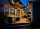 Inviting backyard patio featuring an umbrella, outdoor furniture, and string lights, creating a cozy outdoor space at 3386 Beeler Ct, Denver, CO 80238