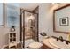 Bathroom features a glass-enclosed tiled shower with decorative accents and bronze fixtures at 3386 Beeler Ct, Denver, CO 80238