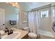 Bathroom with tub and shower combo and a white patterned shower curtain at 3386 Beeler Ct, Denver, CO 80238