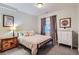 Bedroom with a bed, bedside tables and neutral decor at 3386 Beeler Ct, Denver, CO 80238