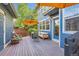 Outdoor deck area with blue siding, stylish patio furniture, and a cozy spot for entertaining or relaxing outdoors at 3386 Beeler Ct, Denver, CO 80238