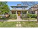 Beautiful home showcasing a cozy front porch, classic architecture, and landscaped yard for enhanced curb appeal at 3386 Beeler Ct, Denver, CO 80238