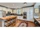 Modern kitchen with white cabinets, a center island, and stainless steel appliances, perfect for culinary enthusiasts at 3386 Beeler Ct, Denver, CO 80238