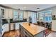 Well-equipped kitchen with stainless steel appliances, a central island, and ample counter space for meal preparation at 3386 Beeler Ct, Denver, CO 80238