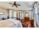 Main bedroom boasts tray ceiling, wood floors, accent rug, and neutral color scheme at 3386 Beeler Ct, Denver, CO 80238