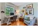 Home office with natural light, desk, chair, and decorative wall art at 3386 Beeler Ct, Denver, CO 80238