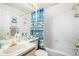 Bright bathroom featuring a shower-tub combination and a neutral-toned vanity at 1079 S Walden Way # 217, Aurora, CO 80017