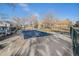 Community pool covered for the off-season surrounded by trees and community buildings at 1079 S Walden Way # 217, Aurora, CO 80017