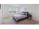 Spacious bedroom with neutral decor and window at 5895 Biscay St # D, Denver, CO 80249